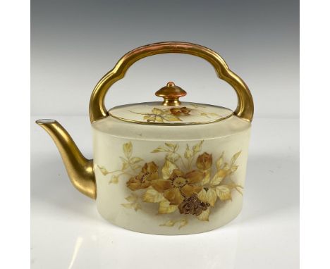 Delicately hand painted autumn colored roses on an oval tea pot with gilded handle and spout. Backstamp Royal Worcester Engla