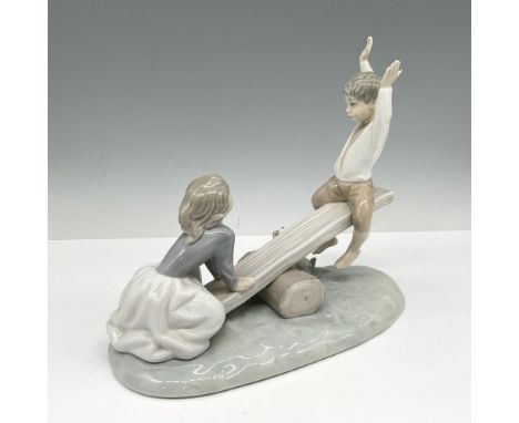 Children playing on see-saw with dog looking on. Colored in cream, white and gray with glossy finish. This item has its origi