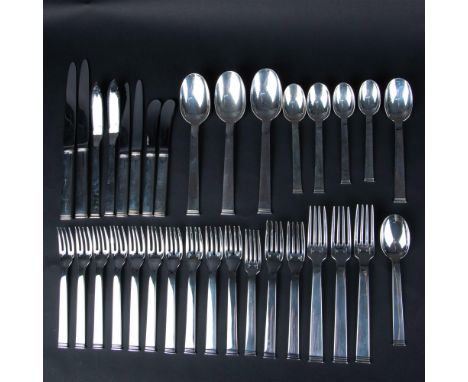 This sophisticated set of sterling silver utensils in the Commodore pattern features: Tree dinner forks, two dinner knives, t