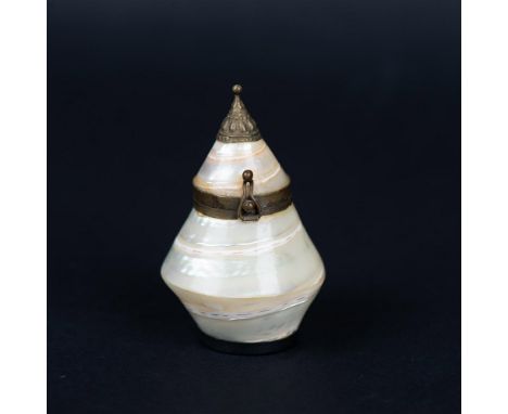 This incredible mother of pearl snuff trinket pill box is made from a whole shell. It has a hinged top with a mirror on the b