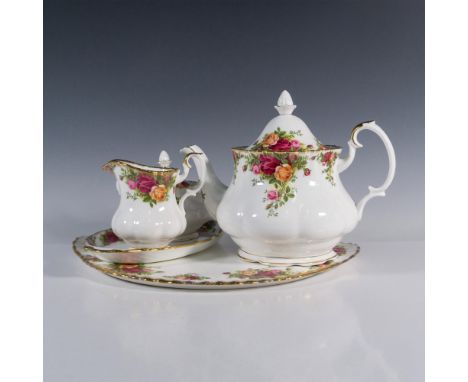 Bone China tea set in magenta, gold and pink roses design; gold rims and handles. Royal Albert backstamp. Teapot with lid 9.7