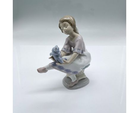 An endearing figurine of what probably most everyone had as a first companion and confidant. It has a gloss finish and bears 