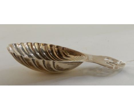 A silver caddy spoon with shell shaped bowl, Birmingham 1979 Condition Report: Available upon request
