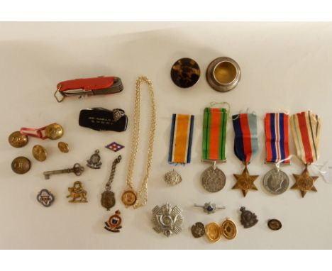 A miscellaneous lot - WWII medals, badge, buttons, inkwell, Swiss army knife and a 9ct gold golf medal Condition Report: Avai