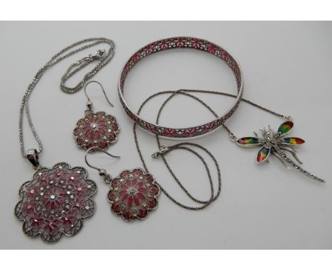 A silver plique a jour bangle with matching pendant and earrings, and a enamelled silver and marcasite dragonfly pendant Cond
