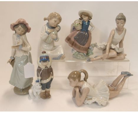 A Lladro Eskimo and polar bear cub, another of a girl holding a basket of flowers and four Nao figures of children Condition 