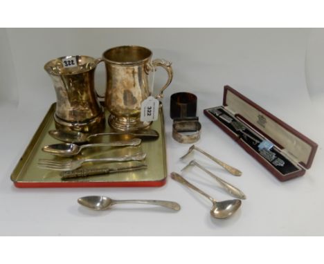 A lot comprising two plated tankards, two napkin rings, loose cutlery and five enamel badges Condition Report: Available upon