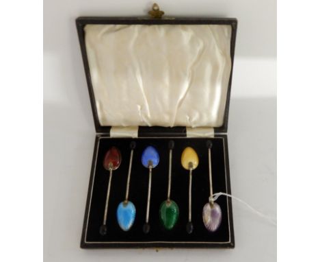 A cased set of six silver and enamel coffee spoons, Birmingham 1934 Condition Report: Available upon request