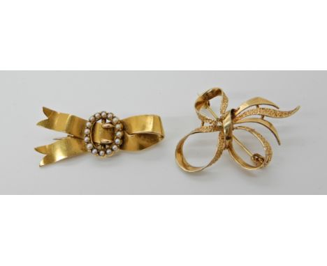 A 9ct gold bow brooch dimensions 4.3cm x 3.2cm, weight 3.8gms. Together with a bright yellow metal buckle brooch set with pea