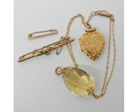 A briolette cut citrine pendant dimensions 3.1cm x 2.1cm x 1.5cm with yellow metal pendant loop, a 9ct heart shaped locket di
