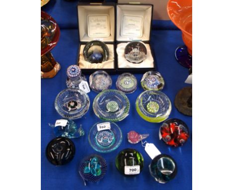 Three Whitefriars millefiori glass paperweights, one with angel decoration, dated 1975, a John Deacons thistle cane dish and 