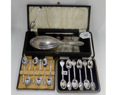 A lot comprising two cased sets of six EP teaspoons and a silver brush and comb set, Birmingham 1940 Condition Report: Availa