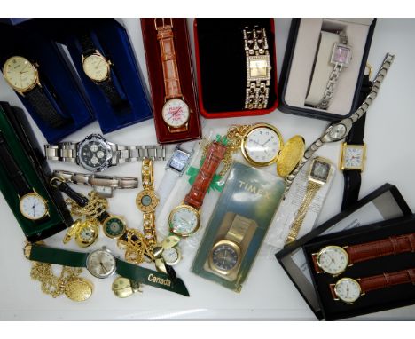 A collection of fashion watches to include a retro Timex Condition Report: Condition report not available for this lot.  