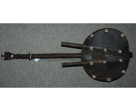 An African eight string Kora bridge harp with cowrie shell decoration Condition Report: Available upon request