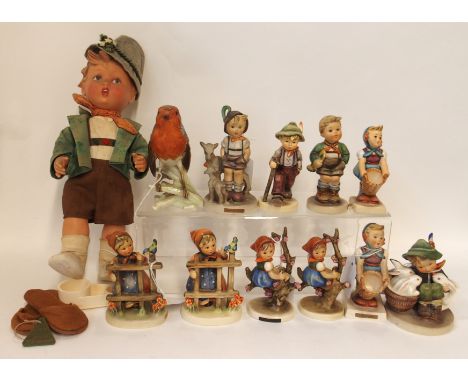 Ten Hummel figures including Playmates, Apple Tree Girl, Little Goat Herder, a Hummel doll and a Goebel robin Condition Repor
