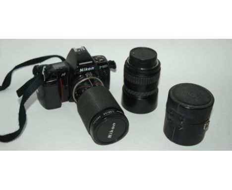 A Nikon F801s camera with lens, further lens and accessories Condition Report: Available upon request