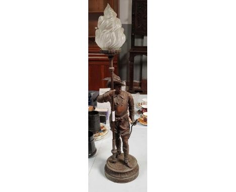 A spelter figure of a standing male in the form of a lamp