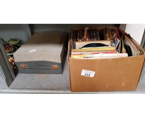 Vintage travelling record player along with a box of records