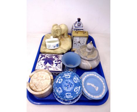 A tray containing Wedgwood Jasperware, china trinket pot, a battery operated carriage clock, polished stone coasters and asht