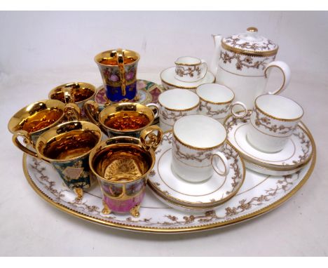 A bone china 12 piece white and gilt coffee service on tray together with six further Italian gilded coffee cans with saucers