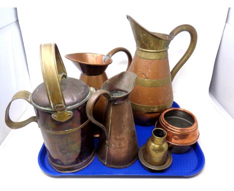 A tray containing antique and later brass and copper ware including jugs, a teapot etc.
