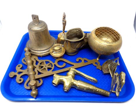 A tray containing antique and later brass ware including a bell, wall bracket, spirit kettle burner, tap, rose bowl etc.