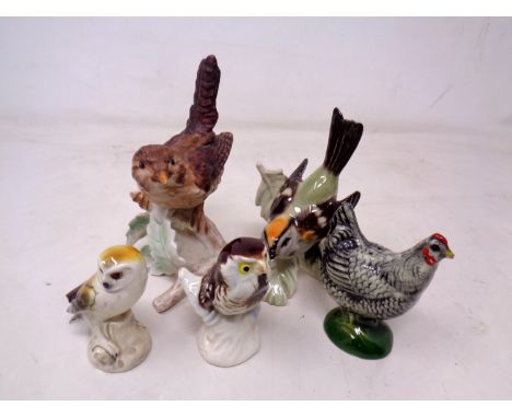 A group of four Goebel china bird ornaments (tallest 12cm).