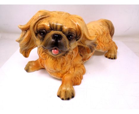 A Goebel figure of a Pekingese dog (length 31cm).