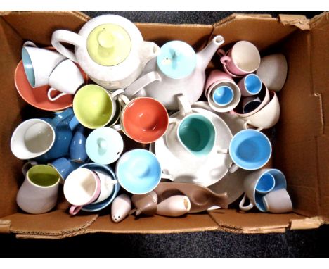 A box of miscellaneous Poole pottery dinner wares.