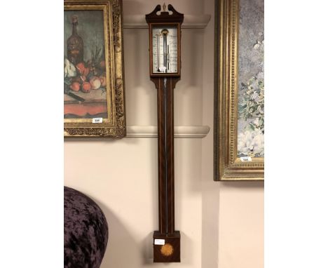 A reproduction stick barometer by Russell of Norwich 