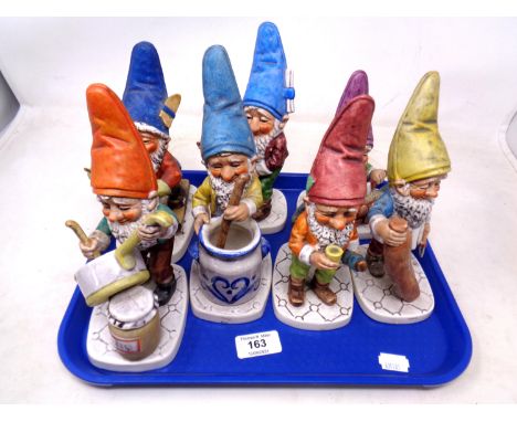 A tray of Goebel garden gnome figures.