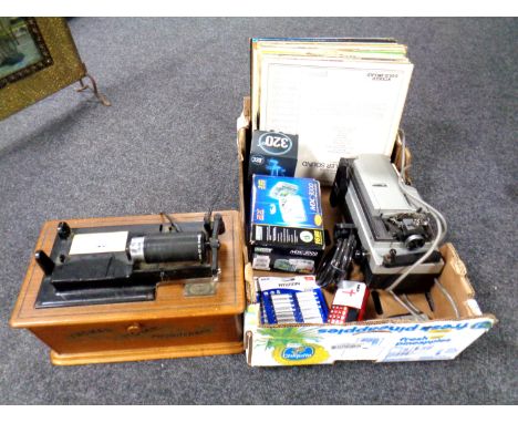 A box containing batteries, a digital camera, LPs, Prinz projector together with a retro style Thomas home phonograph.