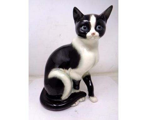 A Goebel china figure of a cat (height 26cm).