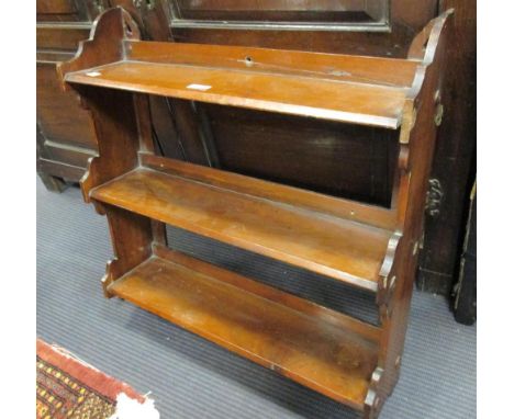 A Victorian walnut wall shelf, 60cm wide, and a painted pine shelf, 59 cm wide (2)  