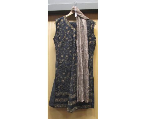 An Indian gold thread and diamante decorated black silk dress, matching pantaloons and a gold thread scarf (A shalwar kameez)