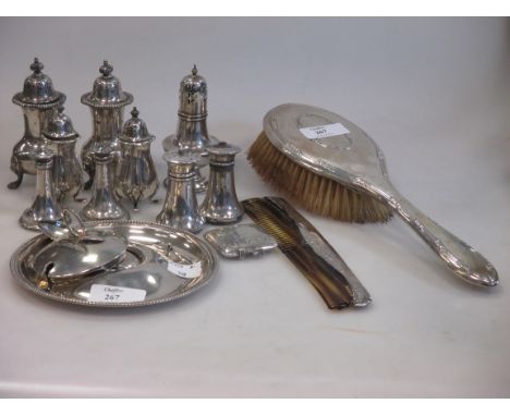 A silver backed hairbrush and comb together with a quantity of scrap silver including various salt and pepper casters etc (17