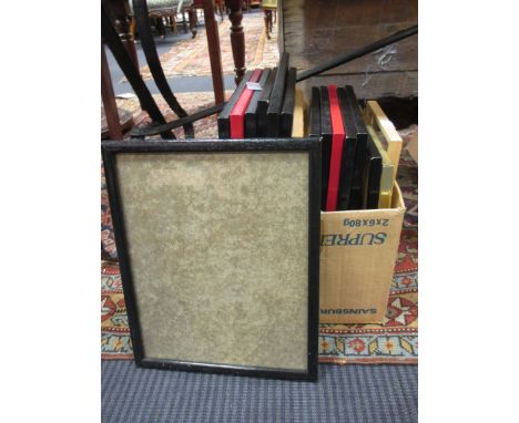 A small box of black print frames