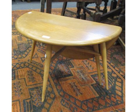 An Ercol Elm drop leaf coffee table  