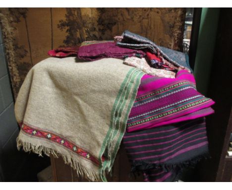 A quantity of Eastern textiles including saris, shawls etc  