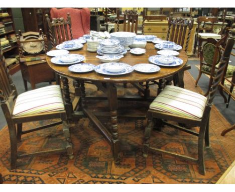 An early 18th century oak gateleg table on bobbin turned and joined legs  