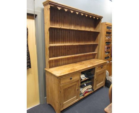 An early 20th century country pine dresser with raised shelf back, 224 x 191 x 54cm deep  