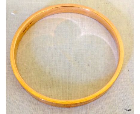 A 9ct yellow gold upper arm bangle Chester 1923