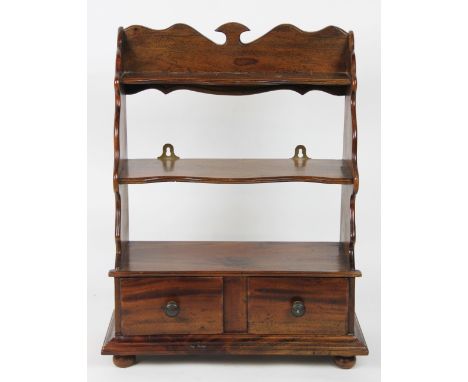 An Edwardian mahogany two tier dressing table shelf, above two drawers, on bun feet, 54cm high, along with an oak drop leaf t