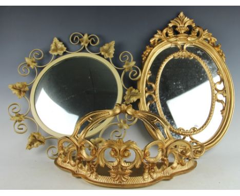 An Italian decorative gilt wood mirror, florally surmounted with an urn, a 1930's oak bamboo moulded oval mirror, a further d