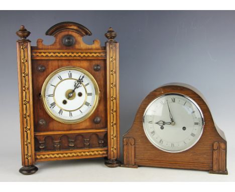 A German oak cased inlaid mantle clock, 19th century , of Architectural form inlaid with parquetry detail, white enamel dial 