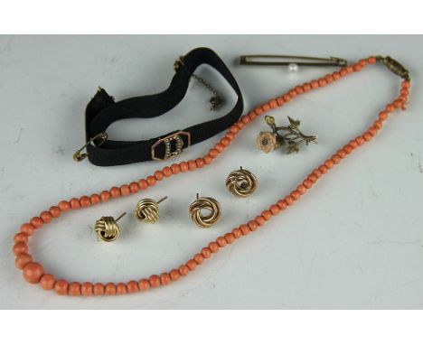A collection of jewellery, to include; two pairs of gold knot ear studs, a moire wristlet with seed pearl D, a carved coral s