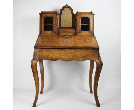 A Victorian walnut and marquetry bonheur-de-jour, with a central mirror above a single drawer flanked by two compartments wit