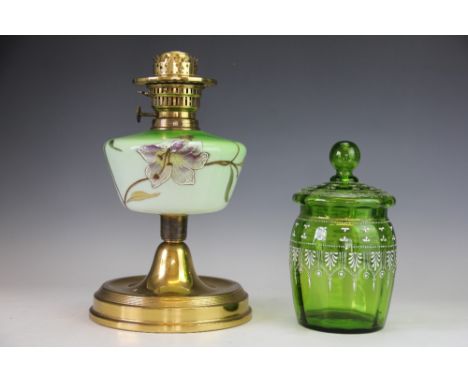 A Victorian oil lamp base, the brass fitting with central green glass reservoir enamelled with a lily, 35cm high along with a