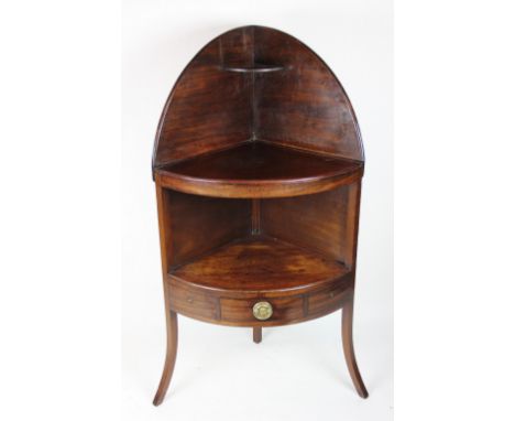 A George III and later corner wash stand, with central drawer and dummy drawers raised on out-swept legs, 117cm high, along w