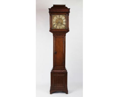 A 19th century eight day oak Grandmother clock, with silvered Roman numeral chapter ring and matted centre with date aperture